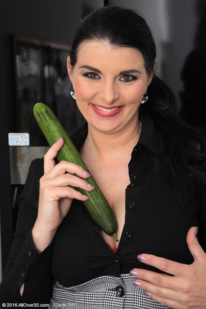 Dark haired lady Sandra Nero pleasures herself with a cucumber after work porn photo #422851959