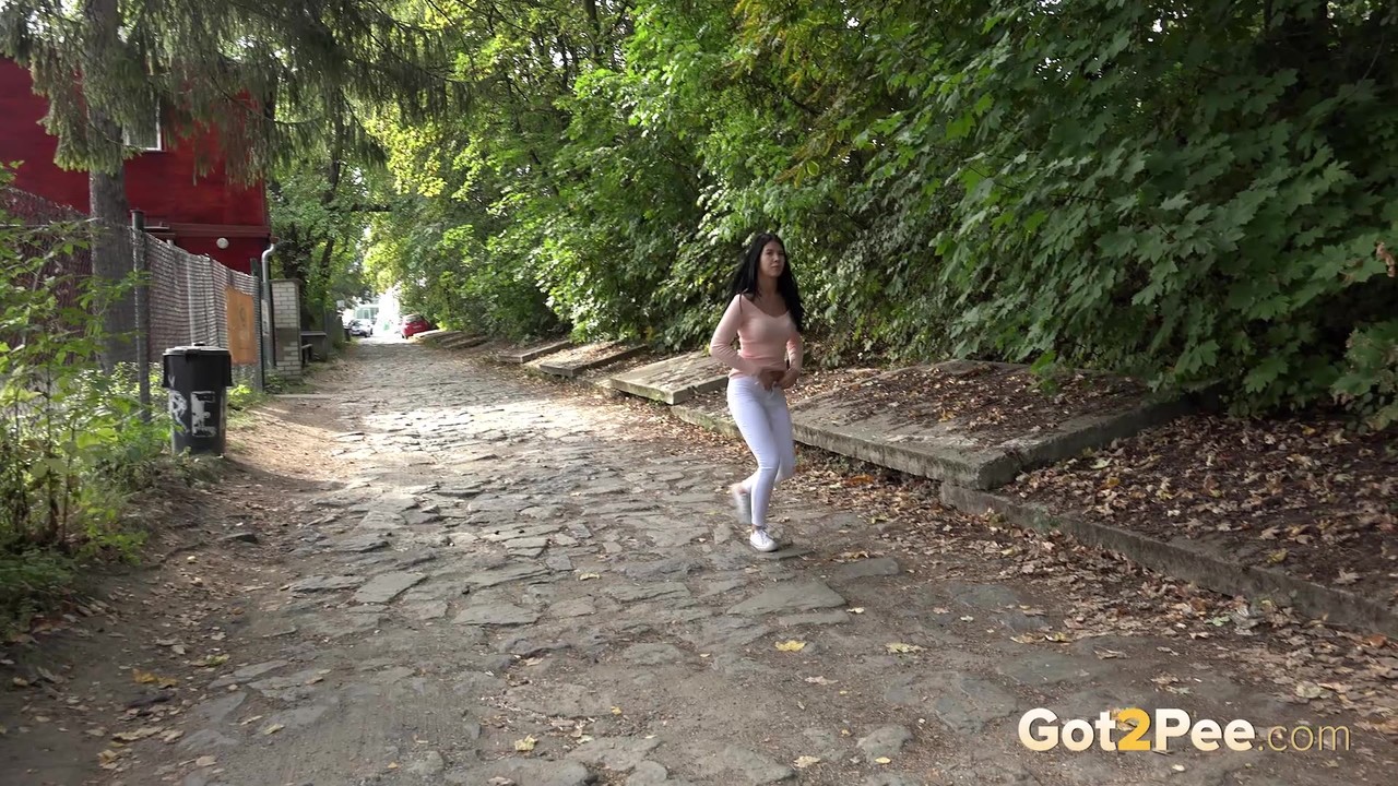 Dark haired girl Dee pulls down her white leggings for quick pee behind bushes porno foto #428754122
