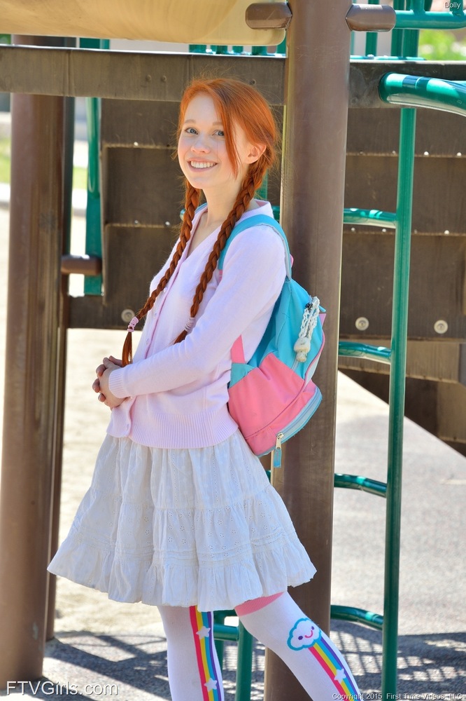 Young redhead in pigtails flashes pussy at the playground & toys in socks foto porno #424534999
