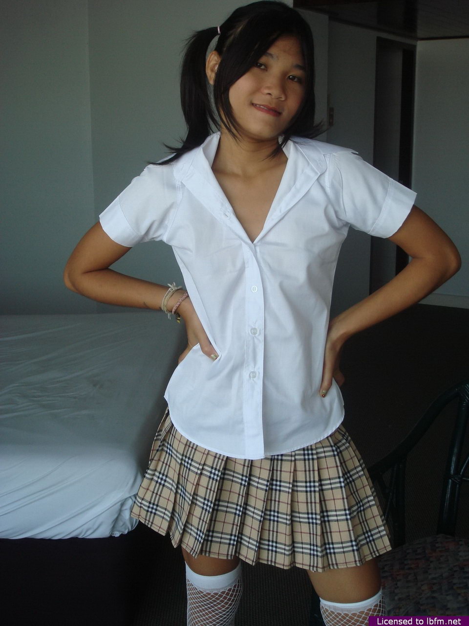 Asian teen takes off her schoolgirl clothes to expose her hairless pussy foto porno #426708043