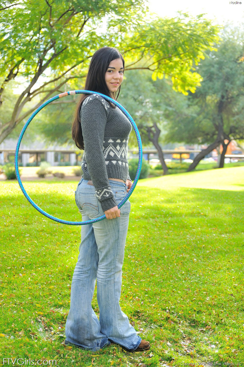 Chubby brunette takes off all her clothes in public while working a hula hoop photo porno #424172588
