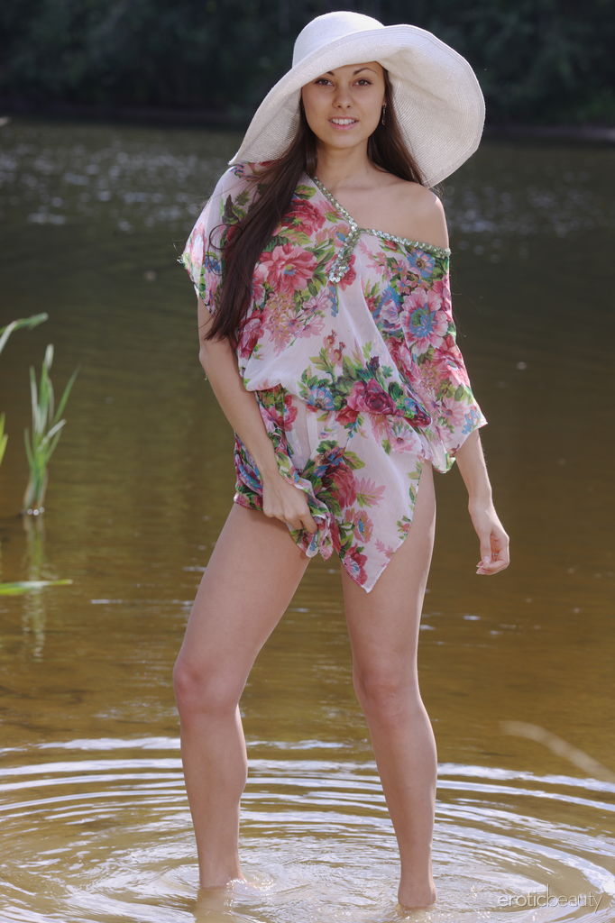 Charming young girl Sila gets naked in a marshy pond while wearing a sun hat foto porno #426808764
