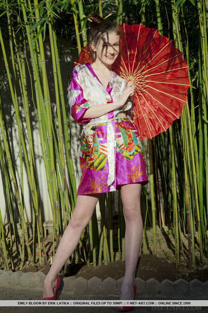 Sexy little geisha Emily Bloom spreading naked to show bald twat in the bamboo porn photo #428771432