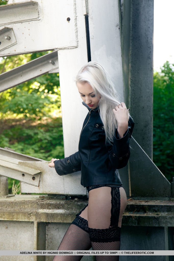 European teen Adelina White takes a pee on trestle bridge in black stockings porn photo #425326450