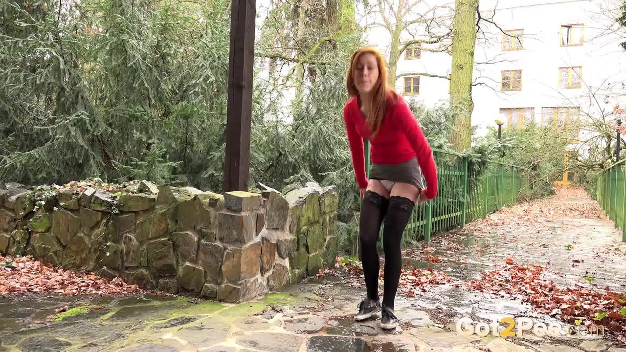 Redhead Sandra lifts her skirt to take a long hot pee in public foto porno #428736397