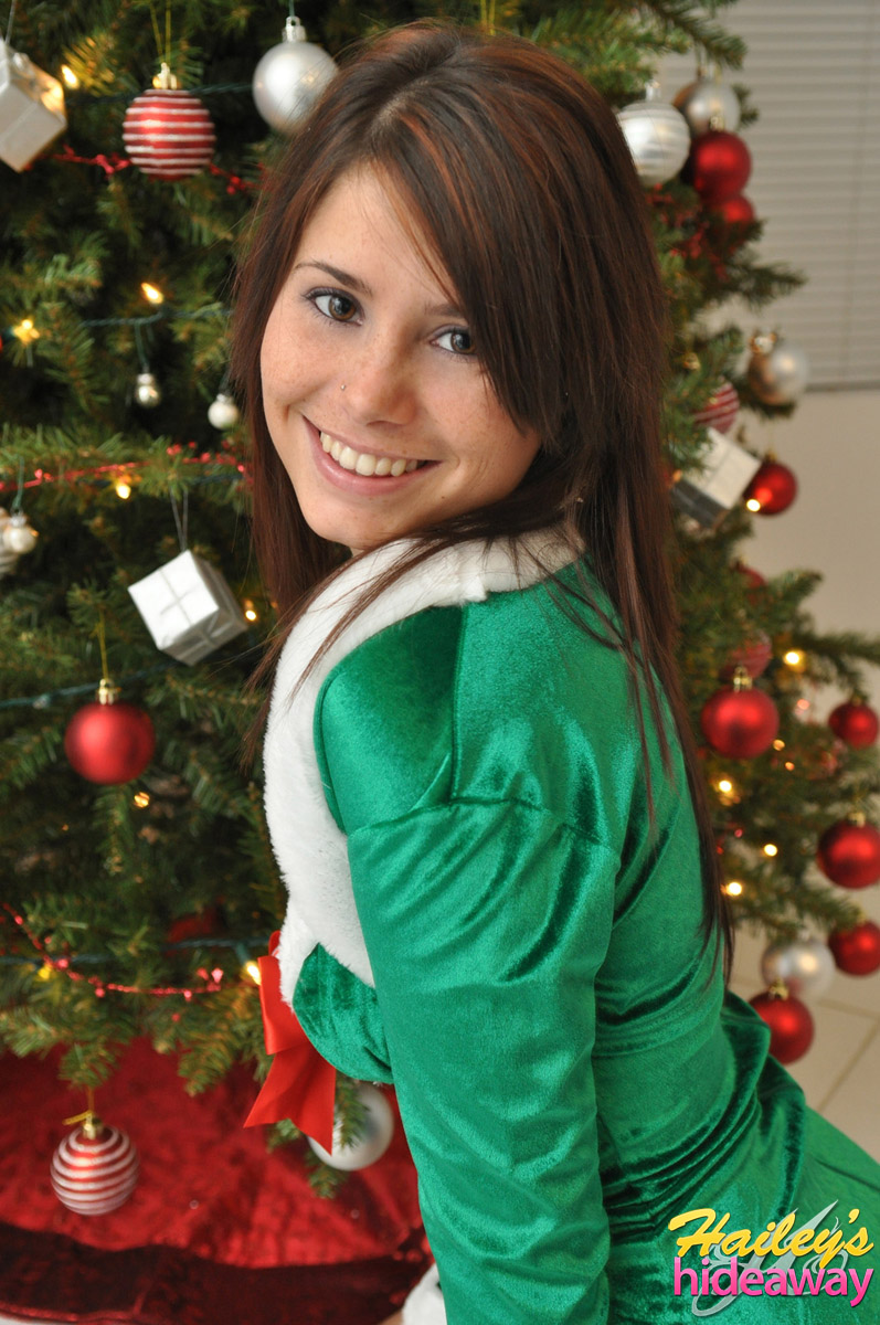 Amateur Xmas elf Hailey lifts her tight skirt to show her sexy ass by the tree foto porno #422721017