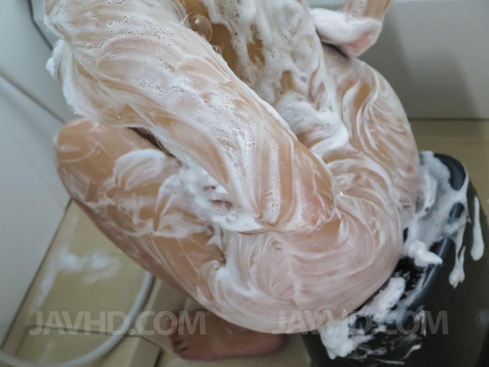 Busty Japanese woman Reiko Kobayakawa soaps up during sex while bathing porn photo #422531253