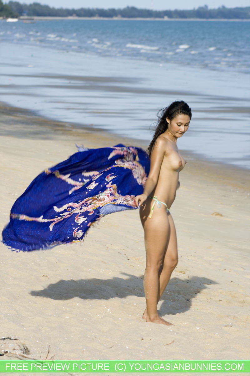 Asian amateur wanders along a beach in just her bikini bottoms 포르노 사진 #428615229