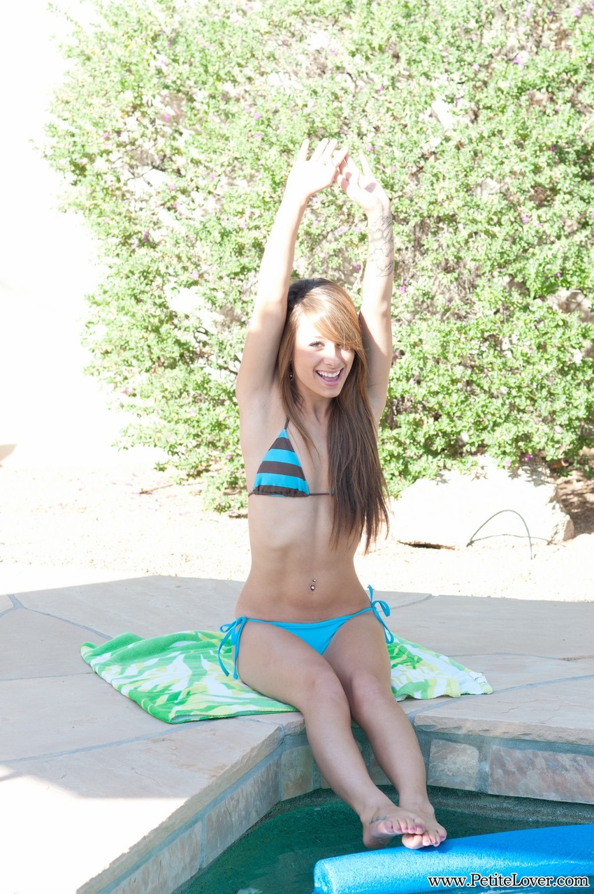 Amateur solo girl takes off her bikini on poolside patio порно фото #425603503