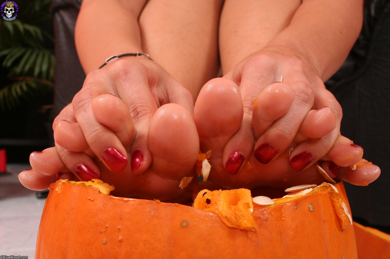 Gorgeous girl Eve Angel crushes a pumpkin with her bare feet porn photo #425820276