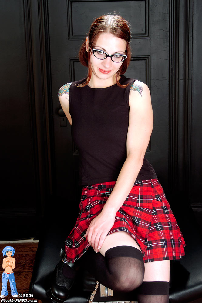 Heavily tattooed redhead strips off schoolgirl attire in black hooker socks porn photo #424347788