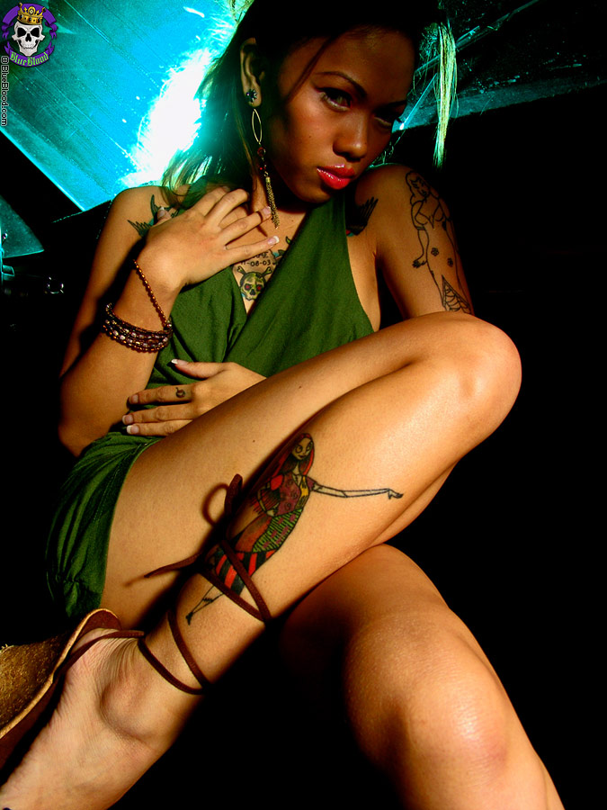 Naughty tattooed asian girl strips strokes in car foto porno #422624573