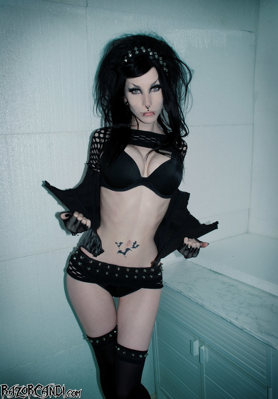 Goth model Razor Candi strikes great solo poses in thigh high bots porno foto #426929403