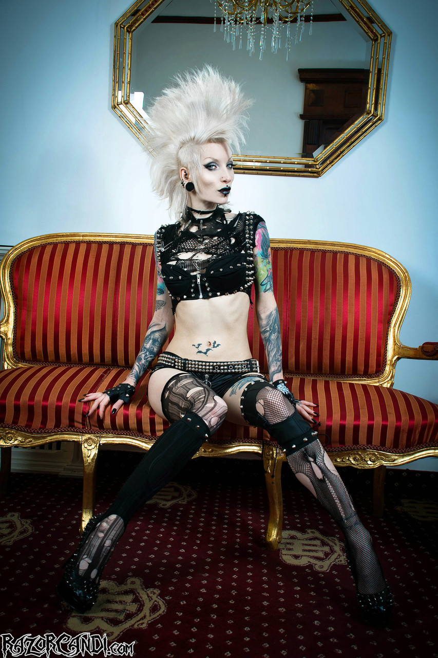 Tattooed punk Razor Candi sports a Mohawk and ripped hosiery during a solo gig porn photo #424851129