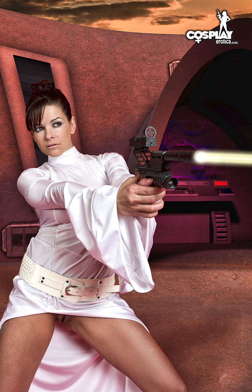 Sexy brunette wields a pistol while removing Space Princess attire 포르노 사진 #423243808