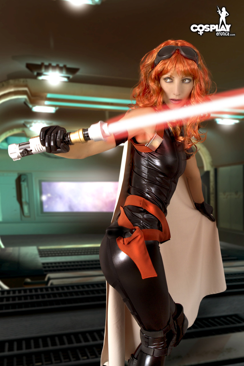 Redheaded cosplayer gets mostly naked while wielding a lightsaber Porno-Foto #422889534
