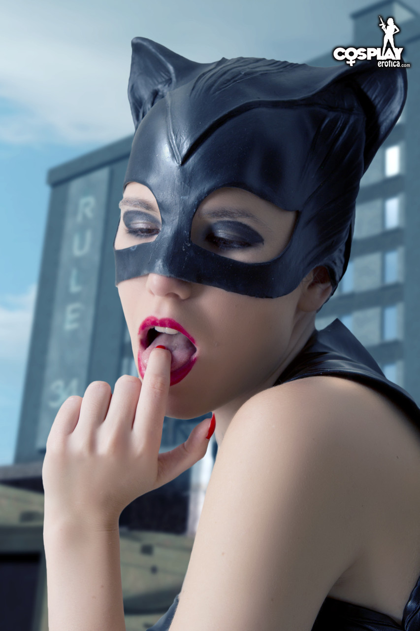 Beautiful girl gets naked in a leather Catwoman hood on a rooftop porn photo #424729011