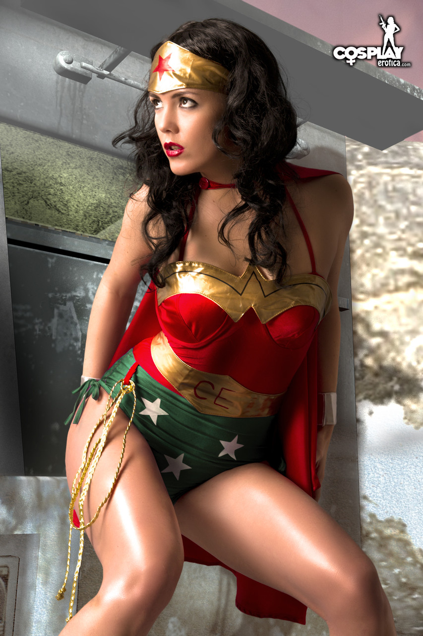 Beautiful brunette peels off her Wonder Woman outfit in a tempting manner porn photo #423048556