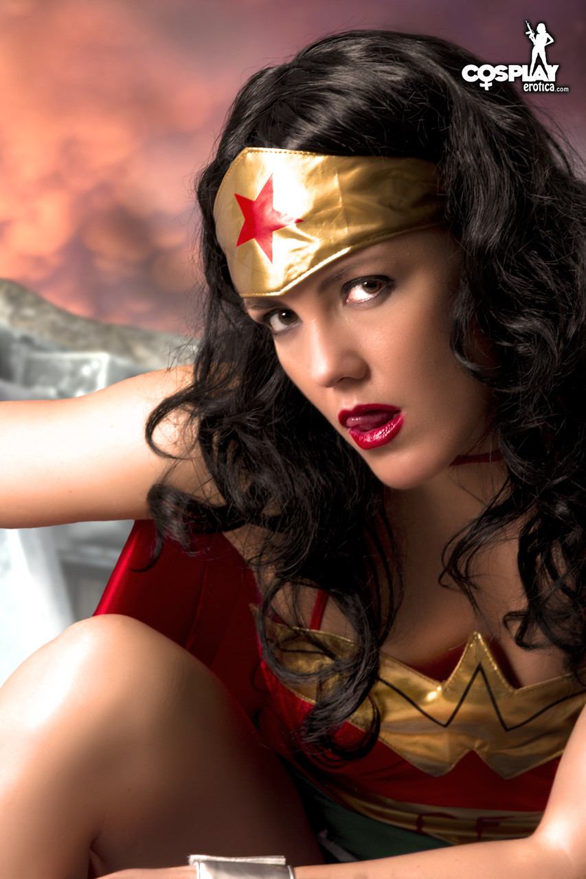 Beautiful brunette peels off her Wonder Woman outfit in a tempting manner photo porno #423048579