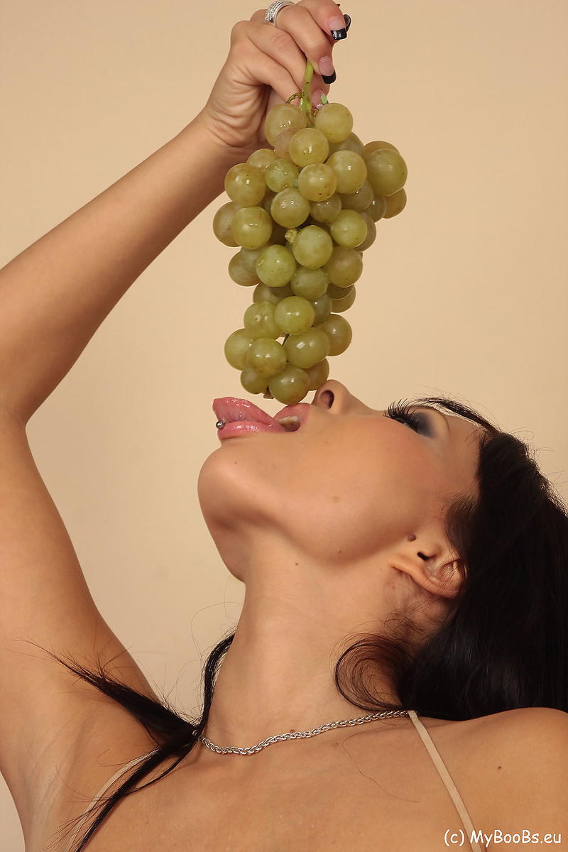 Hot brunette Domino strips to hosiery and boots while eating a bunch of grapes photo porno #424634504