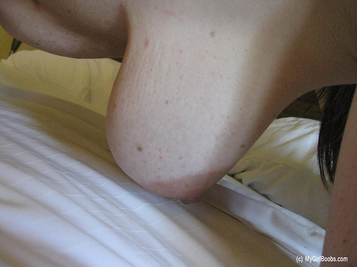 Brunette MILF Ryan Edel holds her big naturals in hands atop bed sheets porn photo #428168194