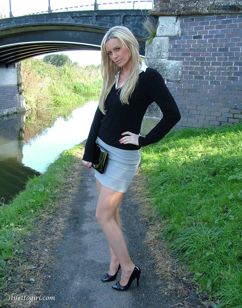 Non nude blonde shows off sexy legs in miniskirt and black pumps on foot path ポルノ写真 #425288895