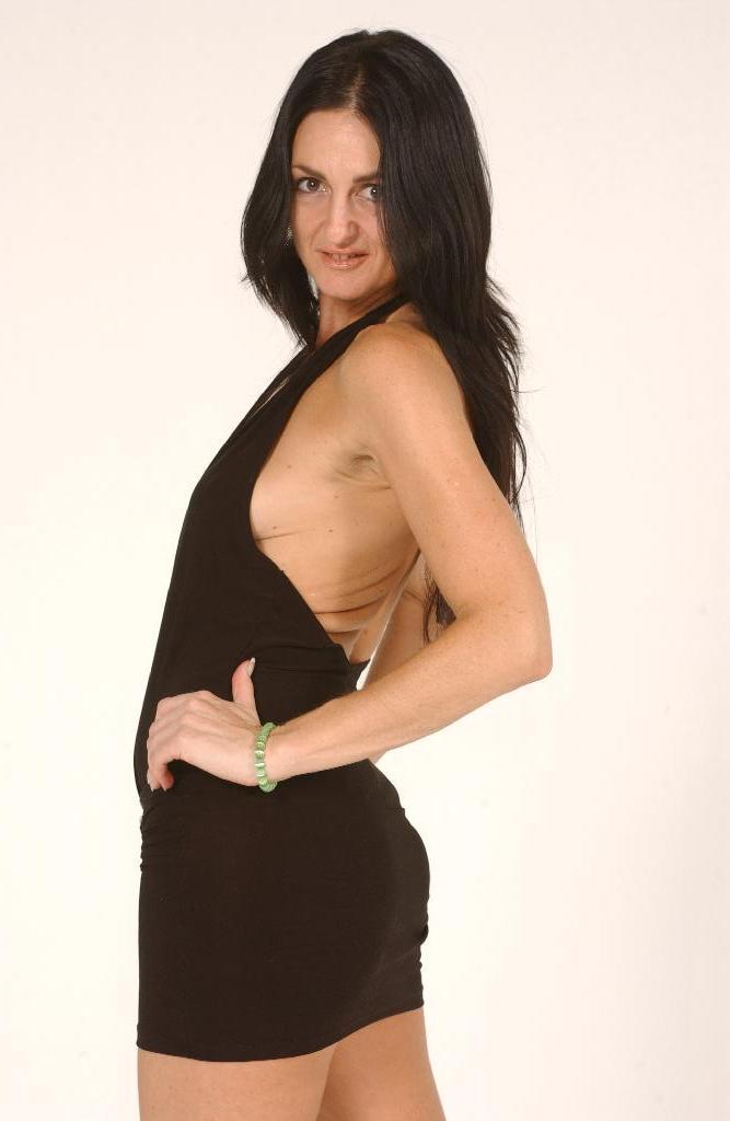 Dark haired MILF Lake Russell wears her sexy halter dress and strap on dick порно фото #427660198