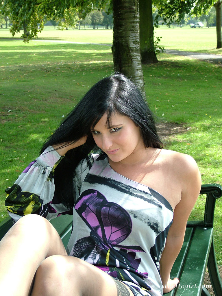 Dark haired girl flashes stocking tops while adjusting her pumps on a bench porno fotoğrafı #424927562