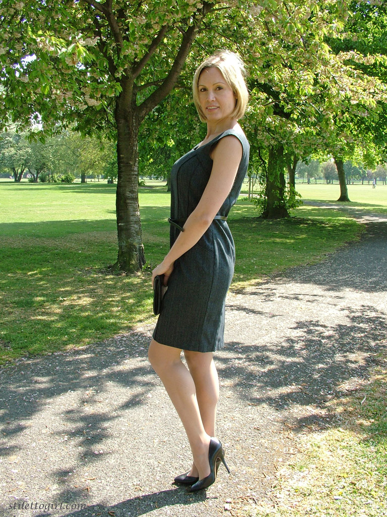 Clothed business woman shows off her sexy legs in high heels in the park ポルノ写真 #422814199
