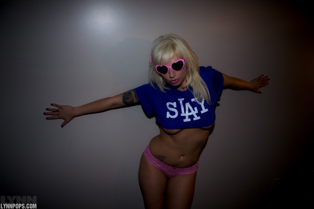 Cute blonde Lynn Pops uncovers her boobs in shades that match her pink undies porn photo #428401199