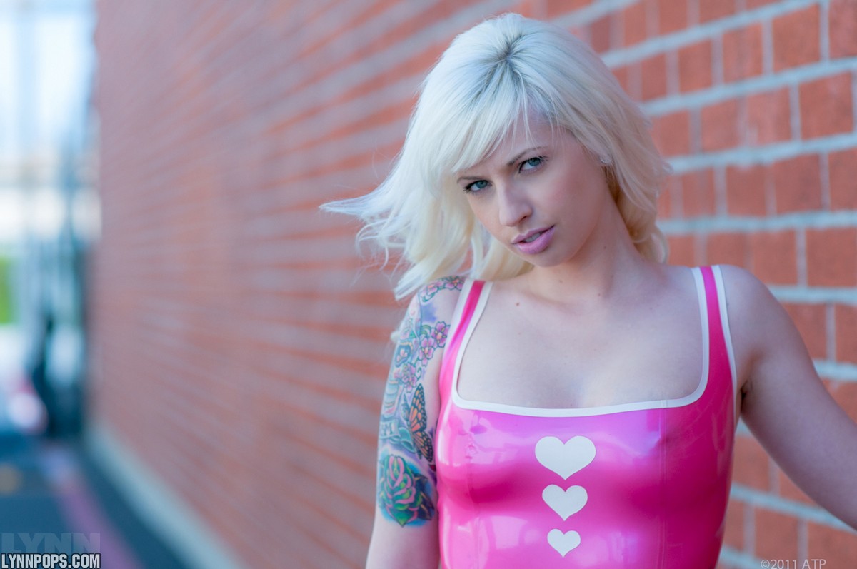 Amateur model Lynn Pops struts in parking lot wearing a pink latex dress porn photo #422887306