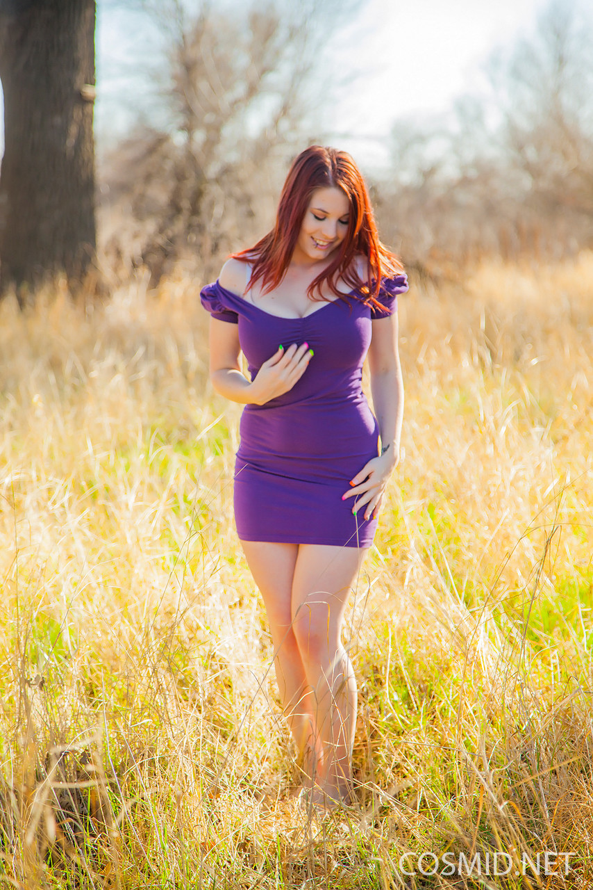 Hot redhead Raven removes her tight dress in a field to flaunt her fat body porn photo #425208329