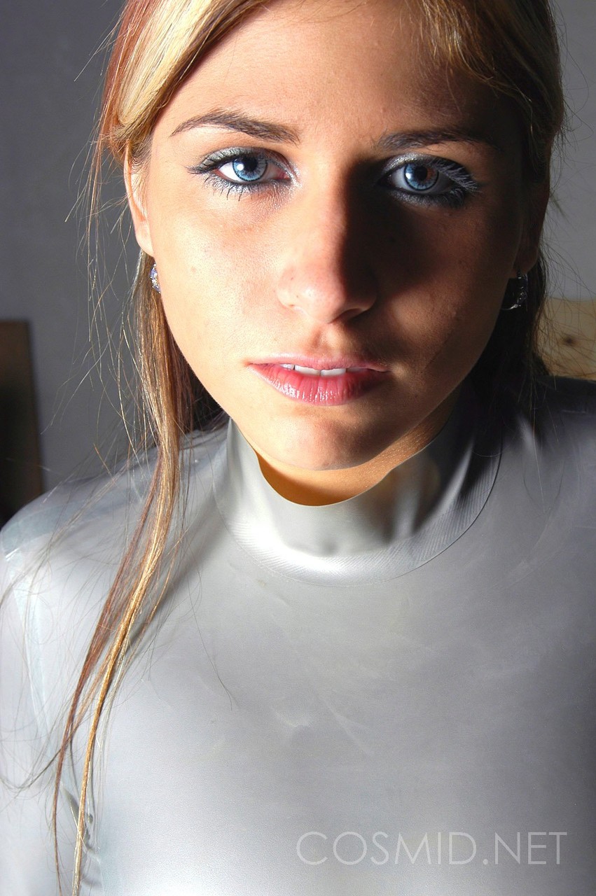 Blue eyed amateur Tara posing to flaunt her massive tits in skin tight latex porn photo #423081860