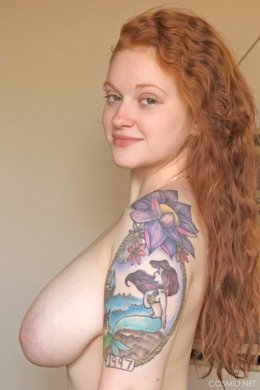 Tattooed redhead with huge floppy tits romping naked on the bed foto porno #424105719