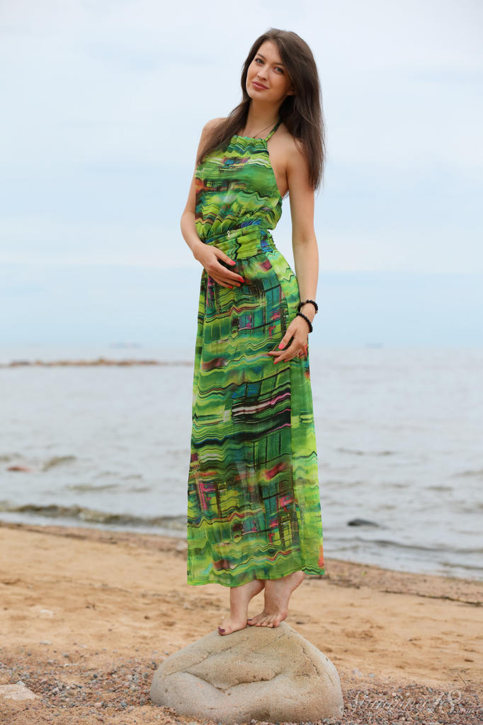Slender teen Ganna A drops her long dress to air perfect tits on the beach порно фото #427858326