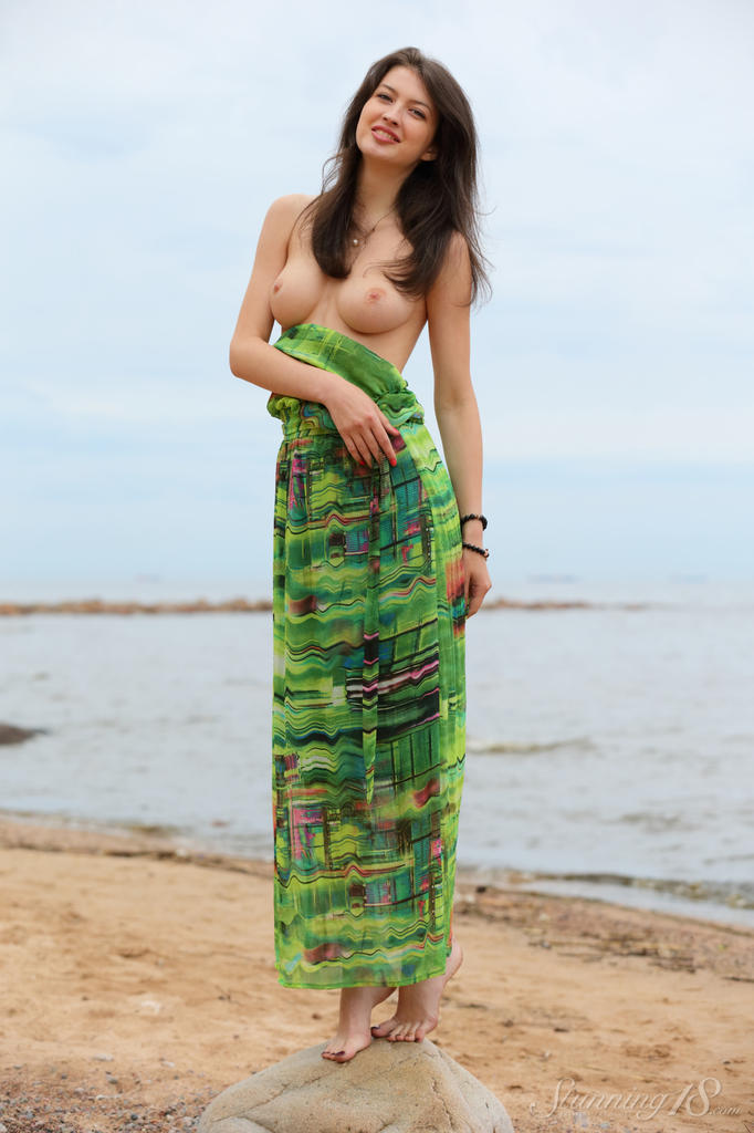 Slender teen Ganna A drops her long dress to air perfect tits on the beach foto porno #427858335