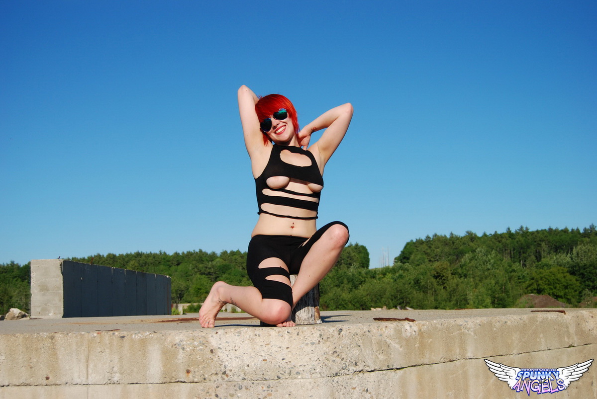 Redheaded Teen Sabrina Exposes Herself On Top Of A Concrete Structure