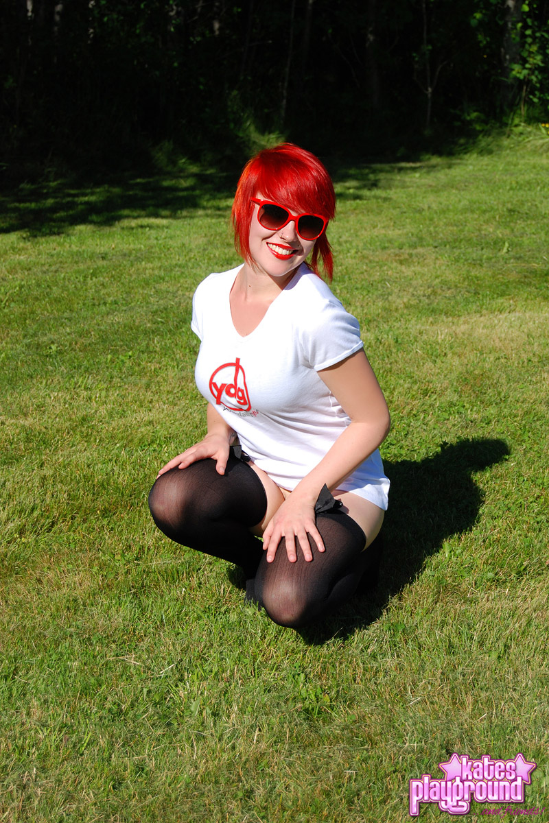 Redheaded amateur Sabrina soaks her white T-shirt out on a lawn in sunglasses porn photo #428574032