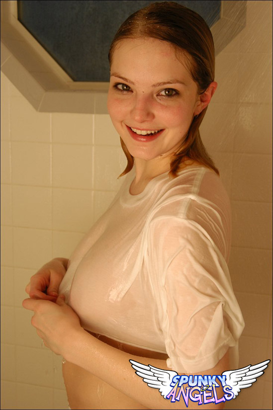 Cute teen girl takes a shower with her see thru clothes on her busty body foto porno #428191527