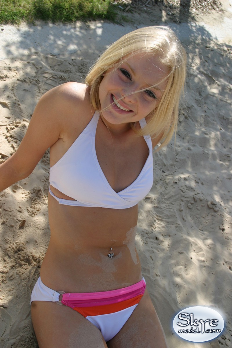 Petite teen Skye Model wearing sexy white bikini and flip flops on the beach foto porno #425393034
