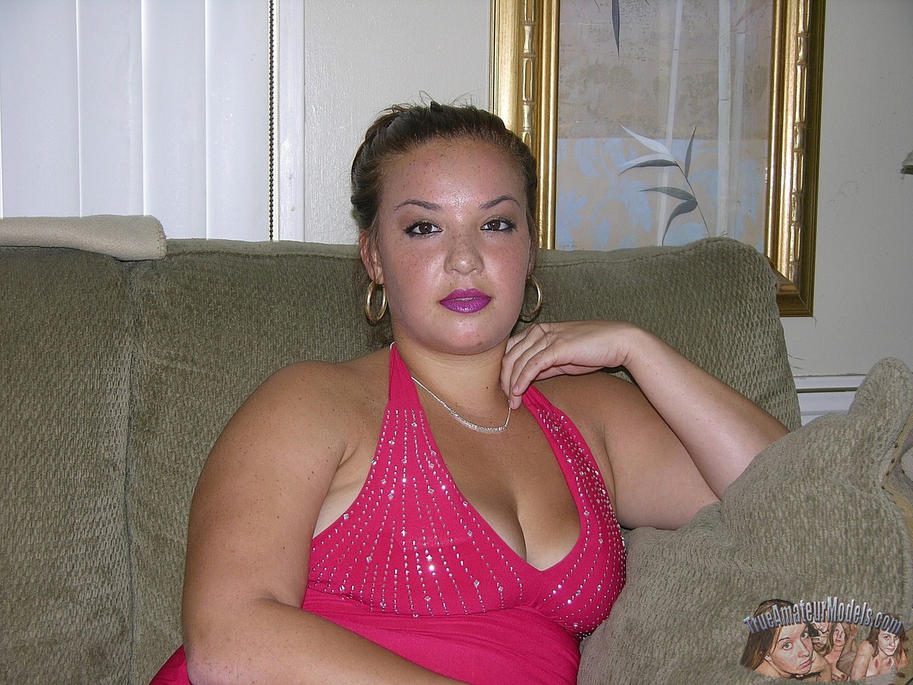 Amateur BBW Brittany K slips off her red dress to model totally naked at home pic