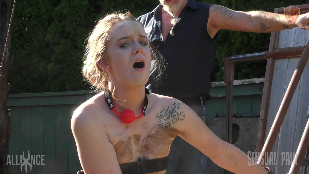 Caucasian Slave Jessica Kay Is Kept In A Backyard With A Ball And Chain