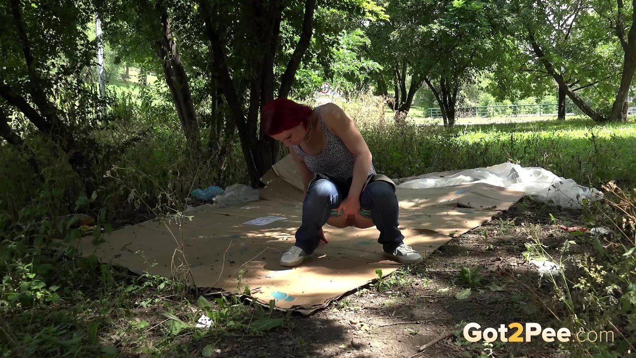 Nasty redhead Sara takes a piss on a homeless person's cardboard flooring 色情照片 #425096238