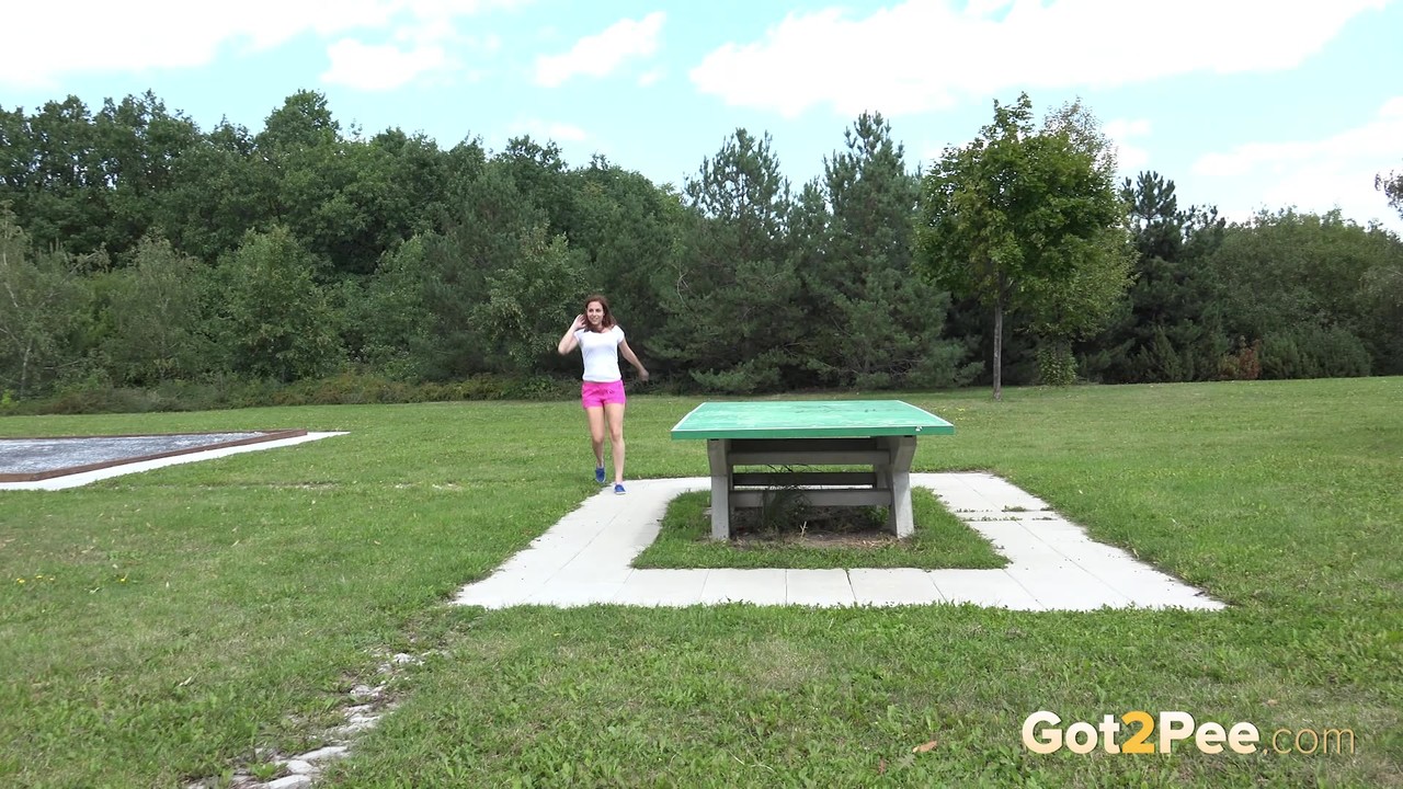 Brunette Antonia drops her pants to pee off the picnic table in the park порно фото #425344769