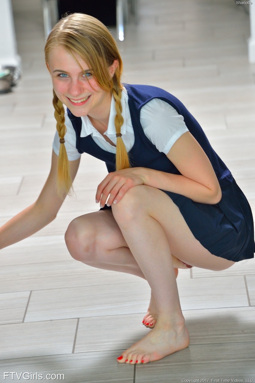 Tiny schoolgirl Sharlotte in uniform bends over for a naked upskirt outside porn photo #428987257