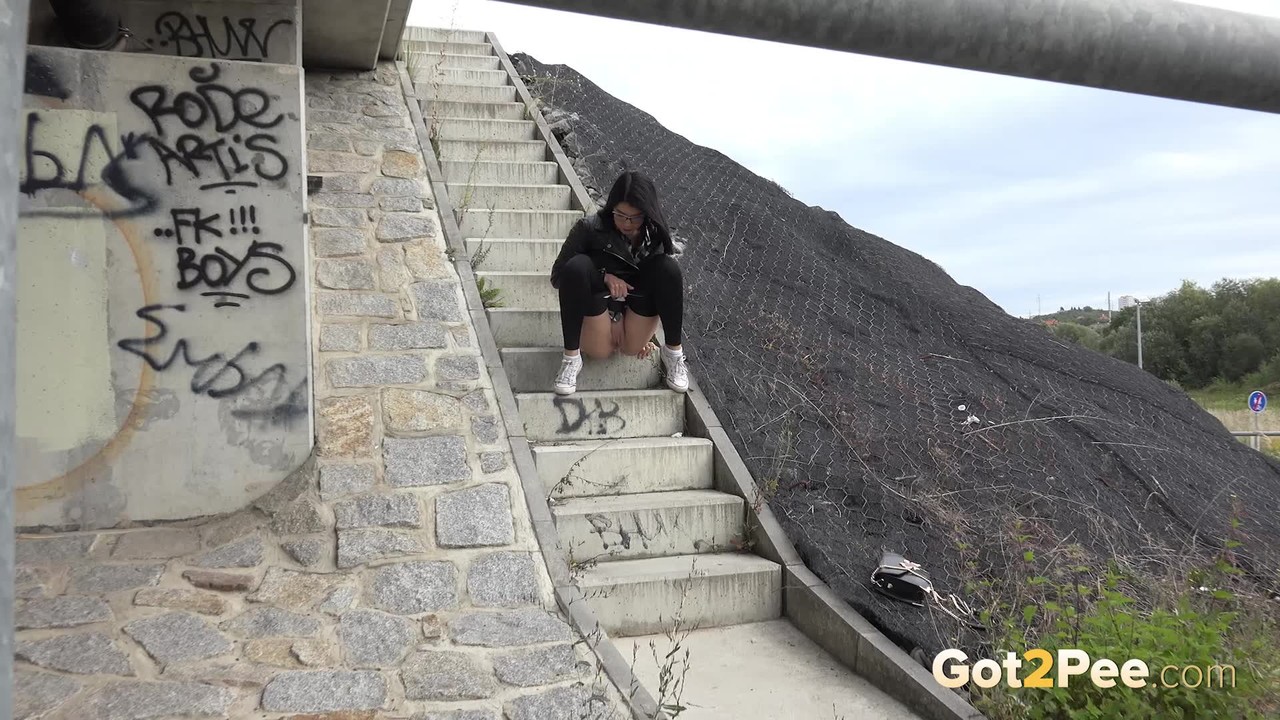 Dark haired girl Dee pulls down her leggings for a pee on concrete stairs zdjęcie porno #428726527