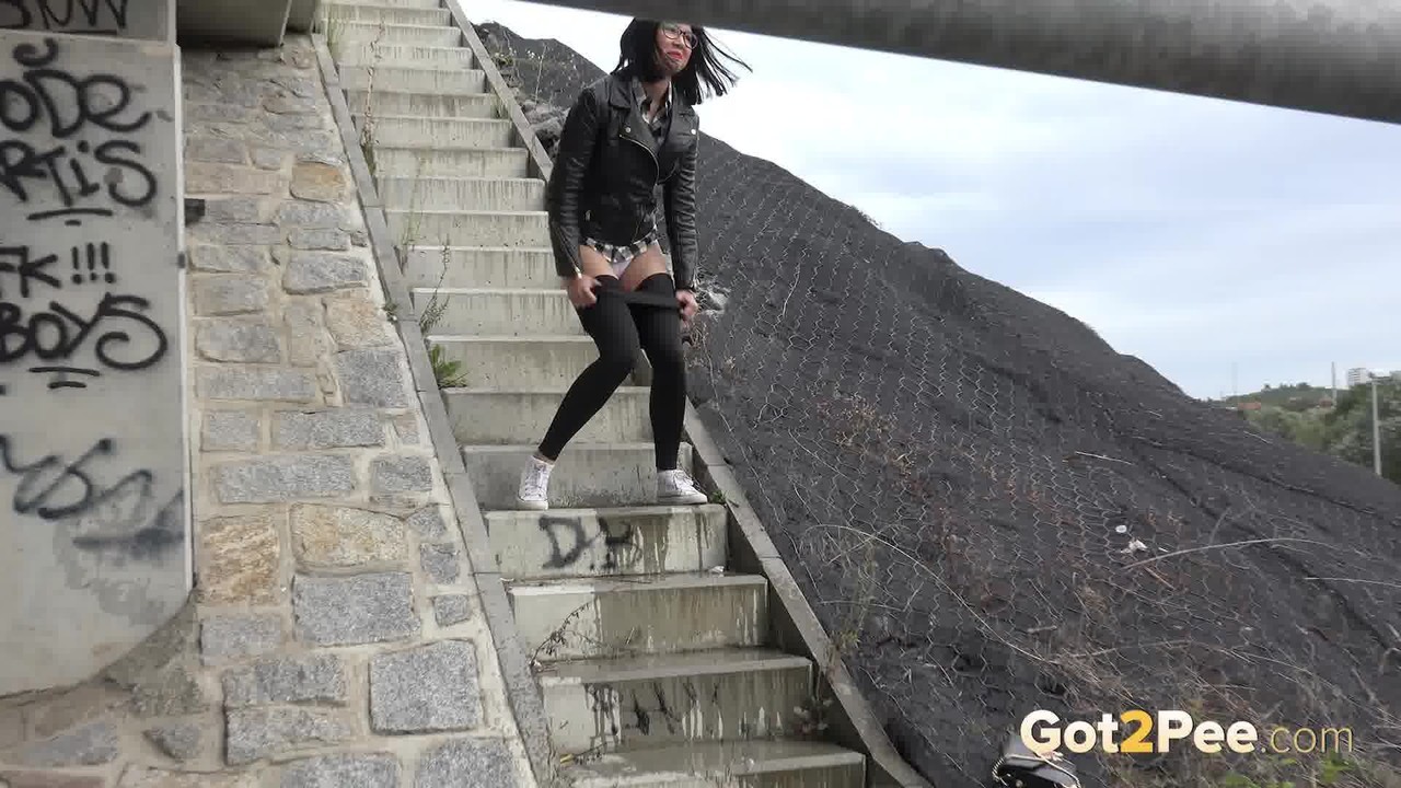 Dark haired girl Dee pulls down her leggings for a pee on concrete stairs porn photo #428726553