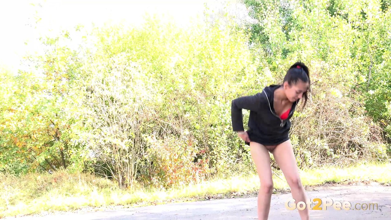 Cute young Esperansa hikes up her short dress to take a hot pee on the path 色情照片 #426444960
