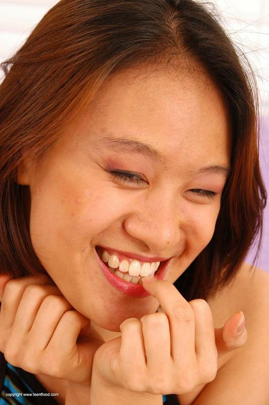 Asian teen May strips totally naked prior to a finger fuck