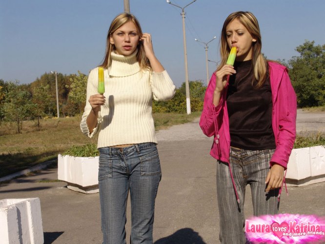 Young lesbians expose their small tits while eating popsicles in a park ポルノ写真 #427992309